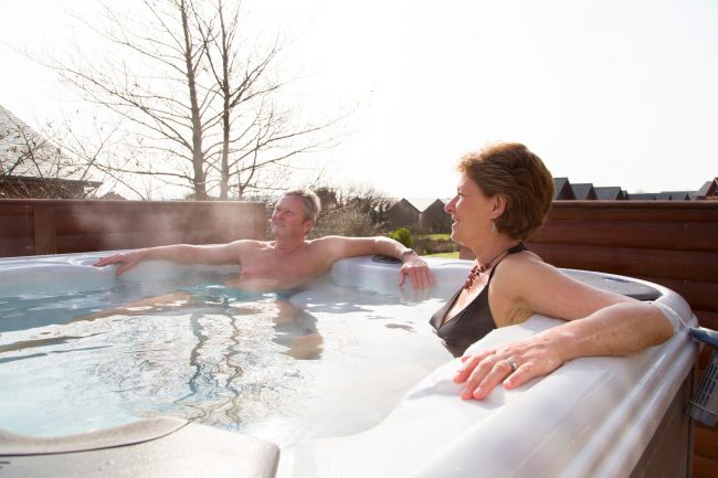 Couple relaxing in a hot tub