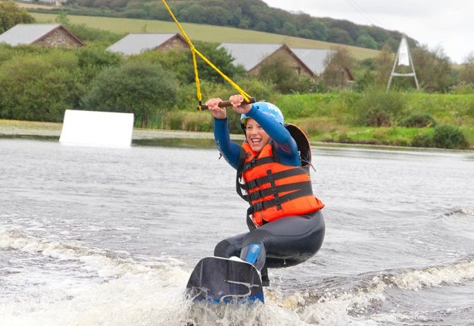 Girl on a Wakeboard on lake in Cornwall
