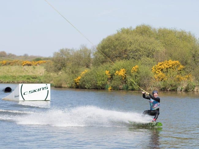 Person wakeboarding at the Retallack lake in Cornwall
